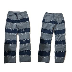 Distressed dark blue jeans